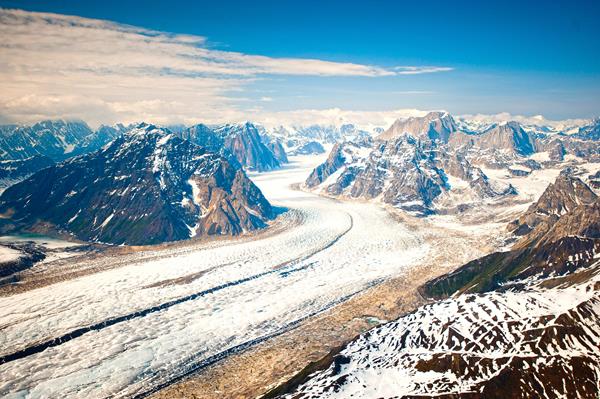 aerial view of mountains and a large glacier