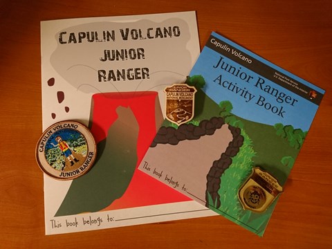 2 Junior Ranger Books and the Junior Ranger patch and 2 different badge
