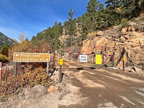 A gate is closed across the entrance to Old Fall River Road