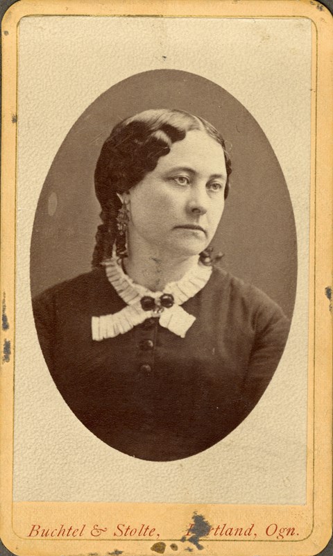 Photo of Maria Barclay wearing a dark-colored dress with a lacy collar.