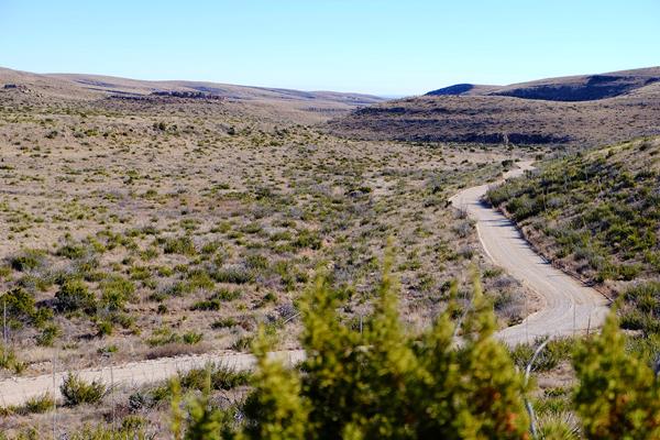Photo showing Walnut Canyon Desert Drive meandering through the Chihuahuan Desert.