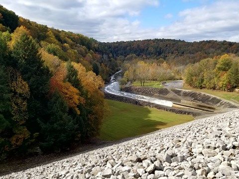 A view of a river valley from the top of a dam