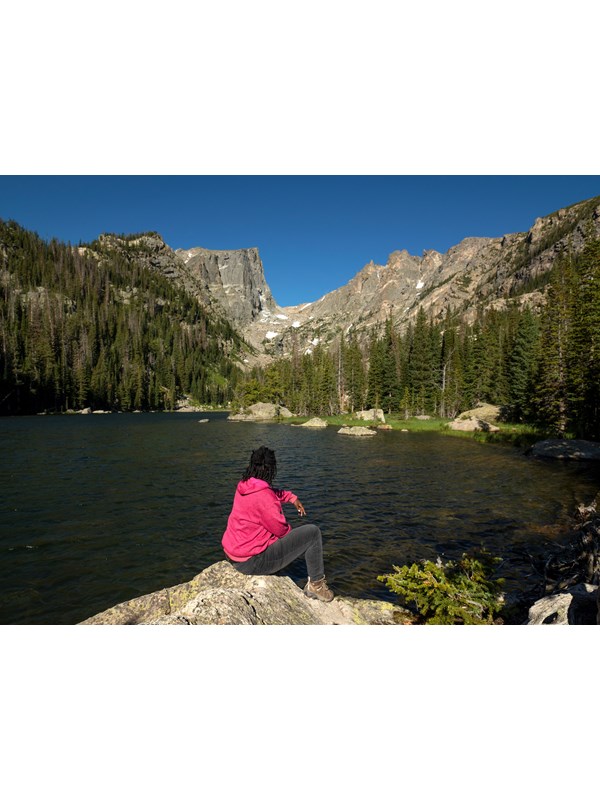 Visitor sitting and viewing Dream Lake