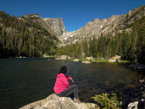Visitor sitting and viewing Dream Lake