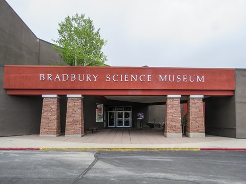 Atop four columns, a red lintel reads "Bradbury Science Museum"