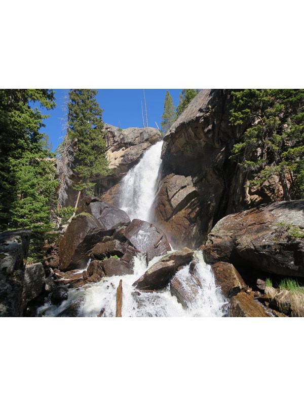 water cascading over a rocky cliff
