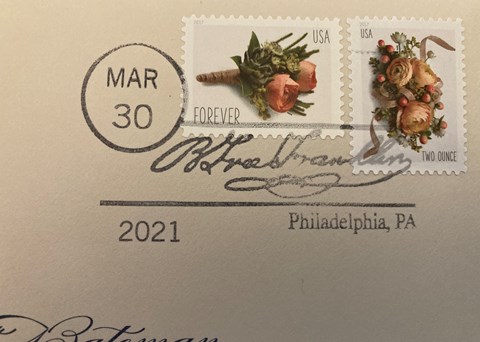 Detail of corner of envelope with the words "B. Free Franklin" appearing over floral stamps.