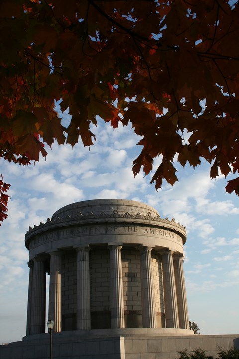 stone memorial with columns and leaves over top