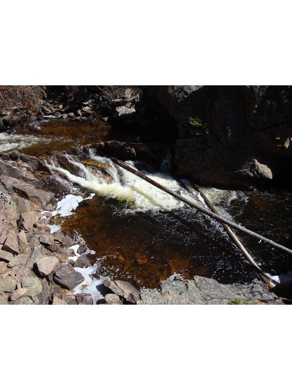 a pool of water with small waterfall