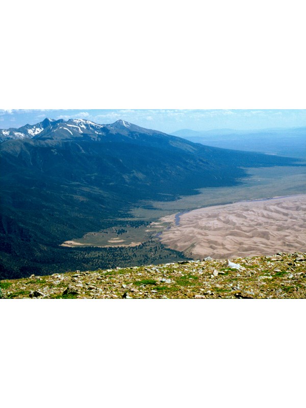Alpine tundra in foreground, part of the dunefield at right, and snow-capped Blanca Peak