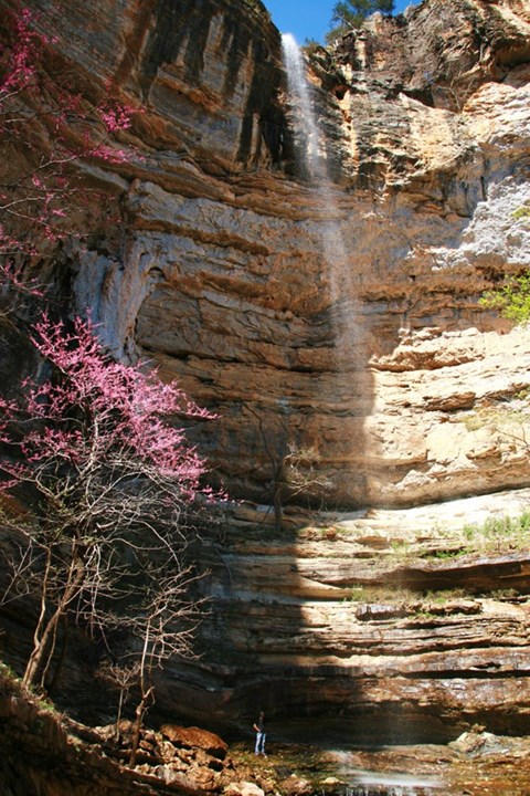 A hiker at the bottom of Hemmed-In Hollow Falls