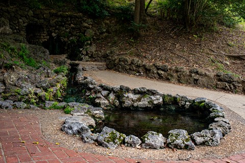 A hot spring with a rock foundation around it.
