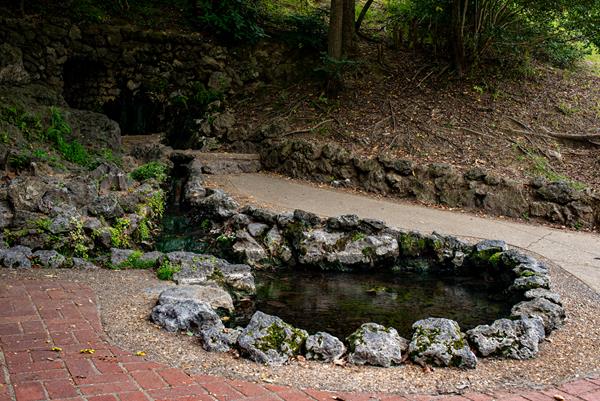 A hot spring with a rock foundation around it.