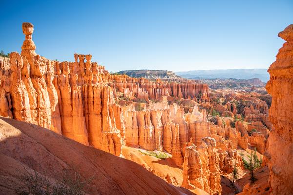 Red rock formations against a clear blue sky