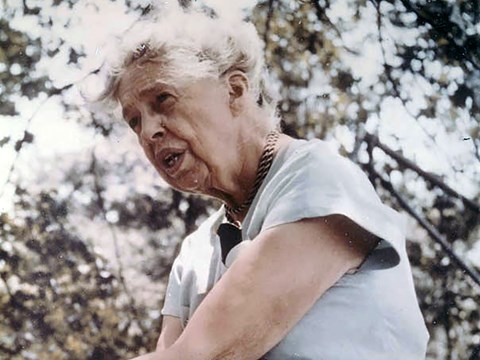 A head and shoulder portrait of a woman (Eleanor Roosevelt) wearing a light blue dress outdoors.