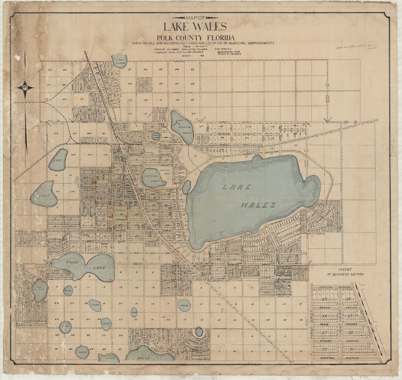 Grid of community with many squares with homes or empty, lots of small bodies of water and one large