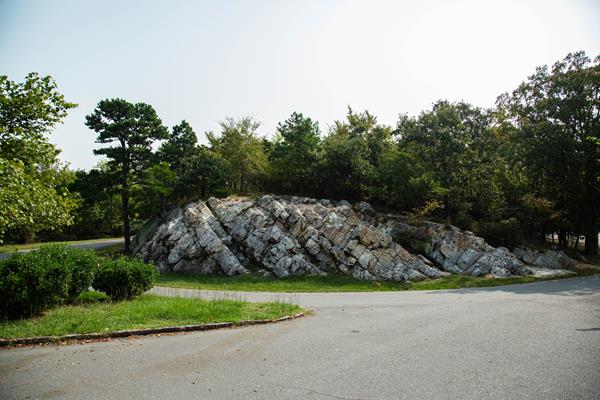 A large chunk of novaculite, about 30 feet wide along a mountain road