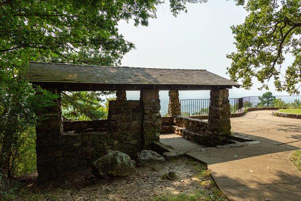 A stone house with exposed walls for viewing the vast overlook