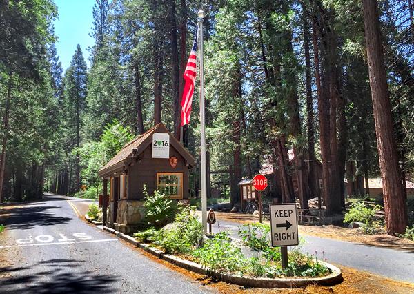 Small wooden building with American flag on pole