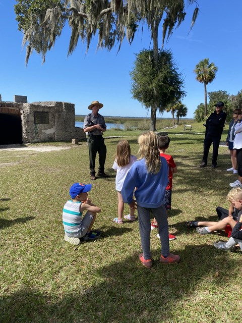 Visitors gathered with park ranger for a town tour at the Kings Magazine.