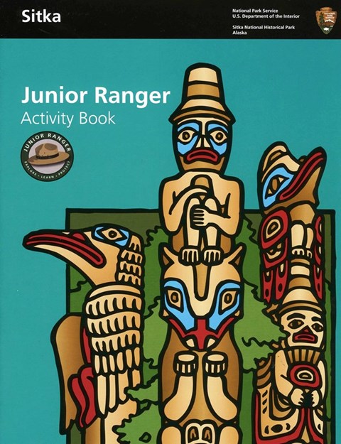 the cover of a Jr. Ranger Book with a stylized image of three totem poles