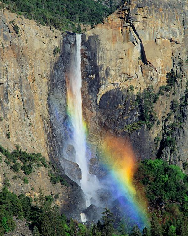 Bridalveil Fall with rainbow in spray of water