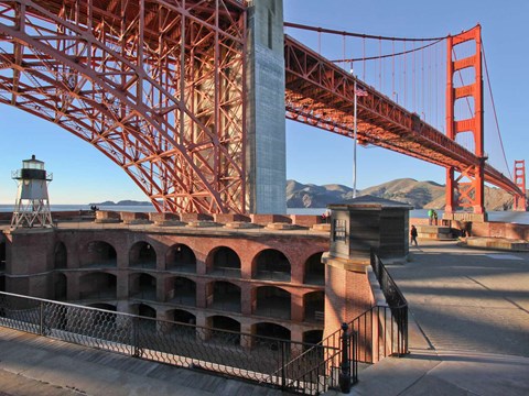 The roof level of Fort Point. The lighthouse is seen on the left and the bridge is in the background