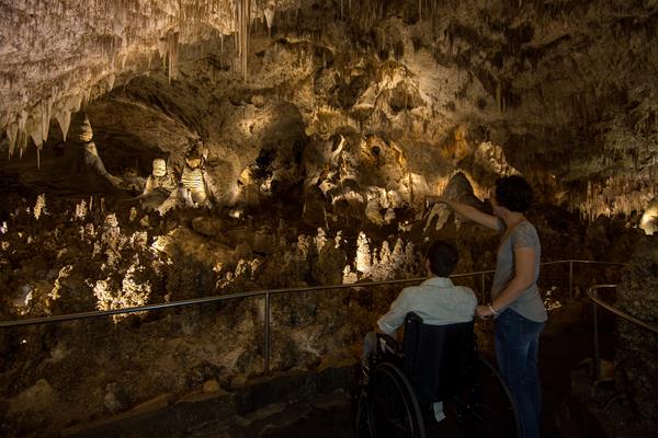 Photo of a visitor in a wheelchair enjoying the Big Room.