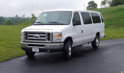 A white 15 passenger van.