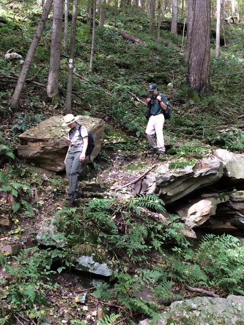 Two people on a rugged section of the trail