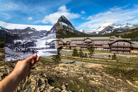 A hand holds historic photo aligned with actual historic hotel building