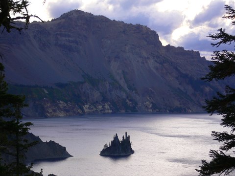 The Phantom Ship, a small rocky island in Crater Lake, at sunset