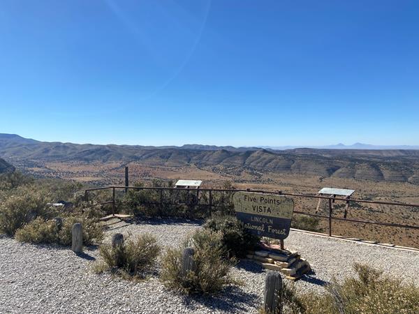 A roadside pull-off with a Forest Service sign
