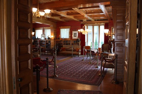 View looking into presidential memorial library showing furniture and window seat.