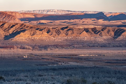 Old historic buildings left in a desert landscape.
