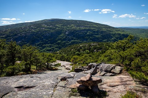 Rock cairns mark a trail on exposed rock