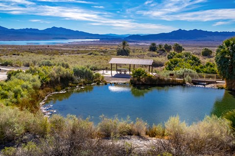 A picnic shelter next to a hot spring