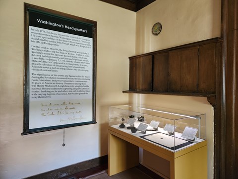 Exhibit case and label banner in historic house space
