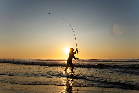 An angler on Assateague at sunrise