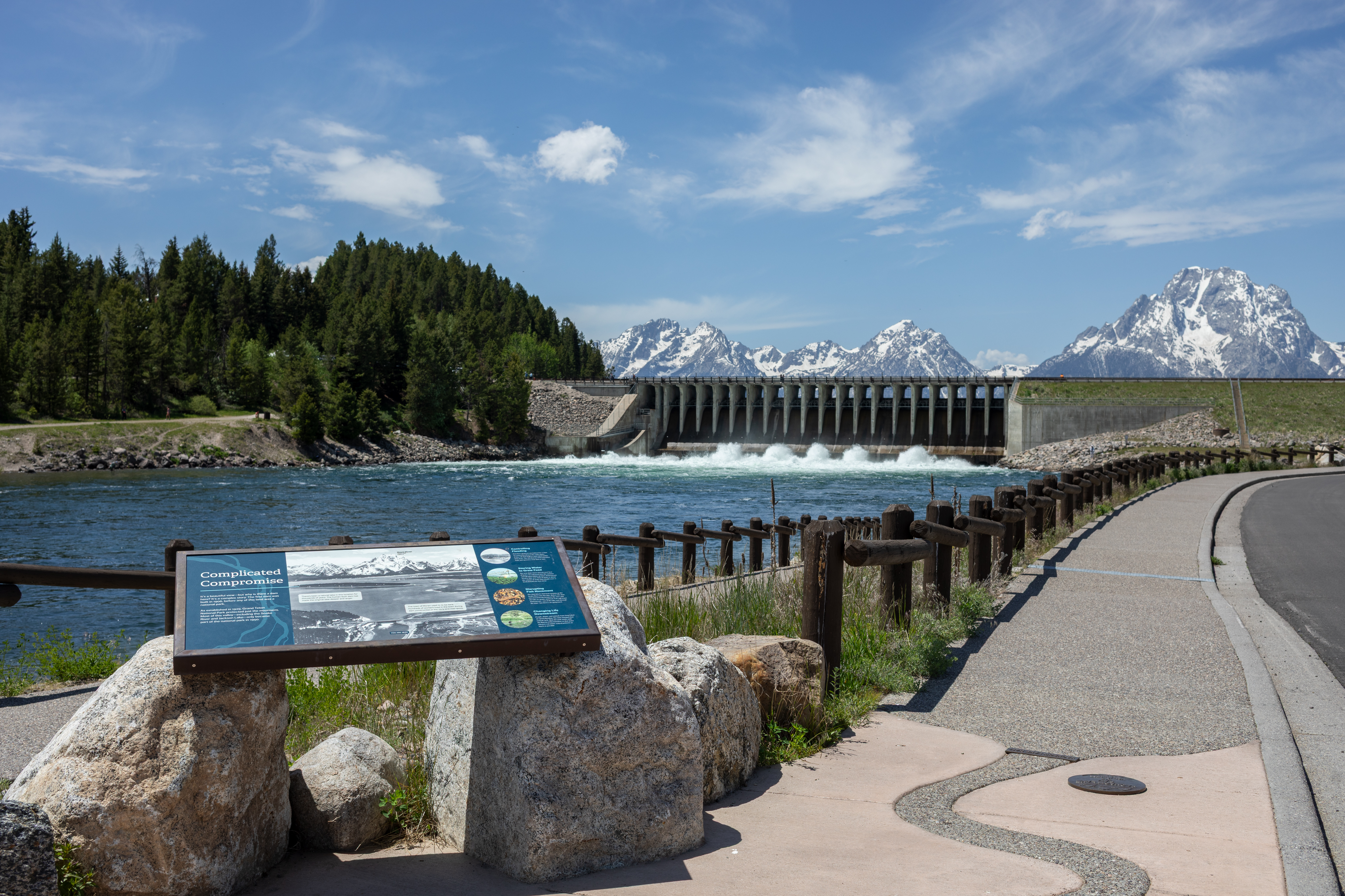 View point of Jackson Lake Dam with mountains in background.