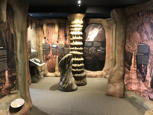 Tan model cave formations inside a visitor center