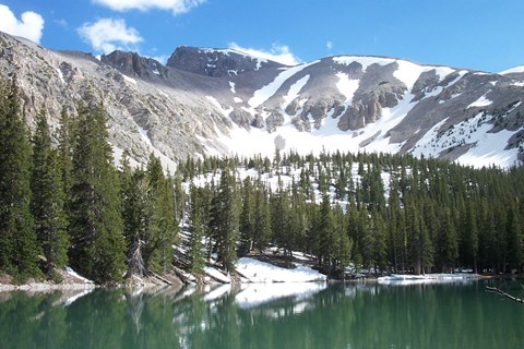 Alpine lake with mountain in the background