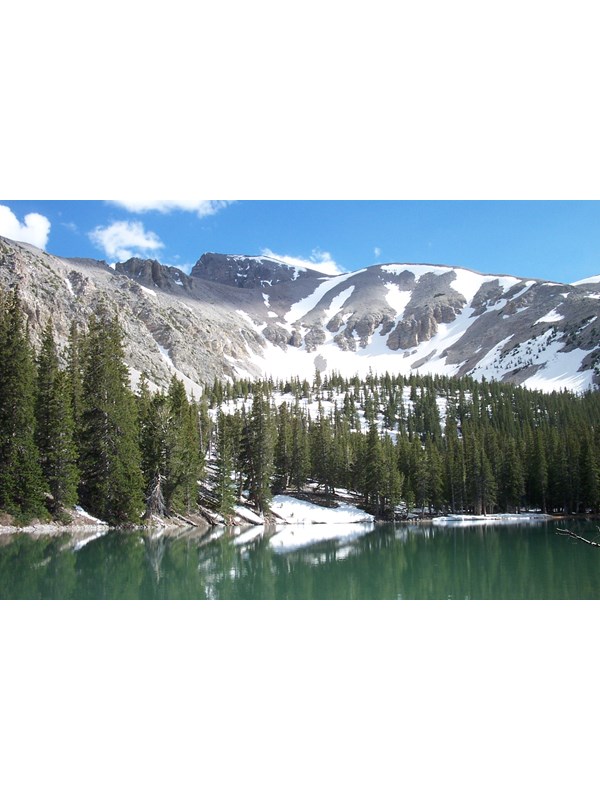 Alpine lake with mountain in the background
