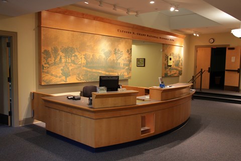 building interior with yellow walls and blue carpeting.