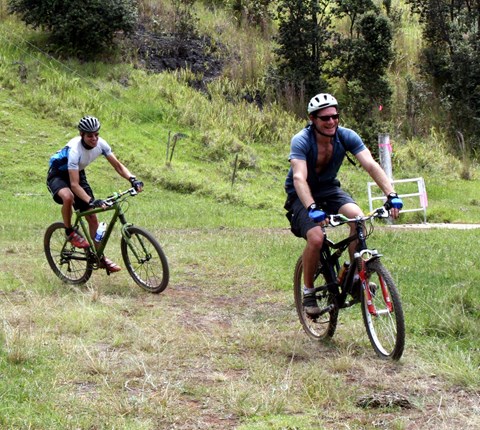 Two mountain bikers enjoy the outdoors.