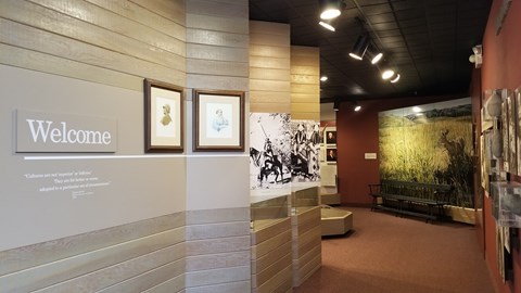 Entrance to museum exhibits with text on the wall reading Welcome