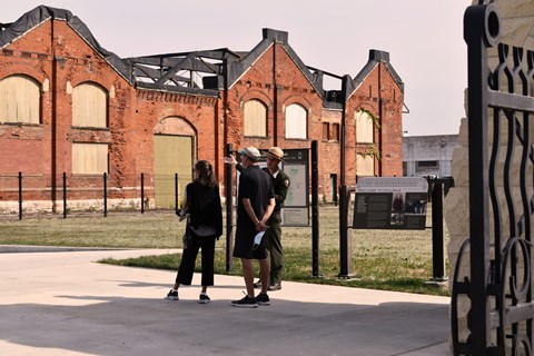 An NPS Ranger leads a tour of the Pullman Factory Grounds