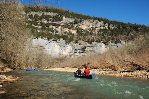 Canoeing beneath Big Bluff