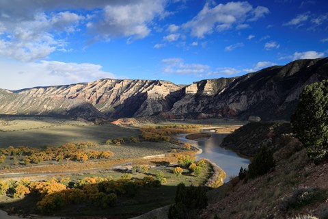 The Green River twists through a landscape of canyons and yellowing trees at Island Park.