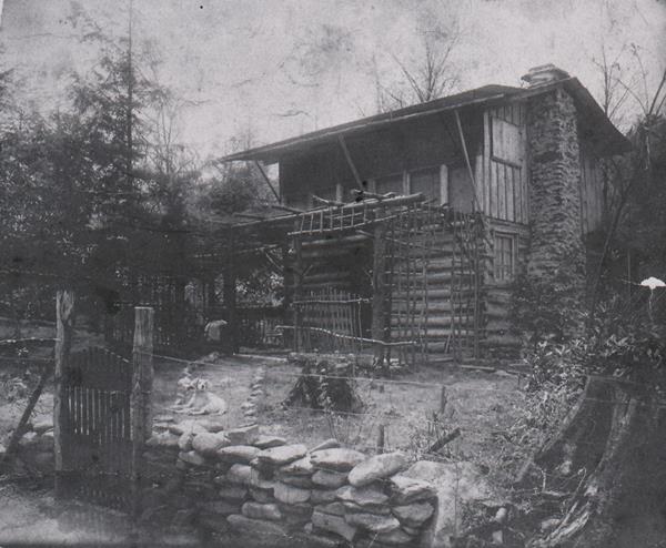 Black and white image of a cabin built in 1910